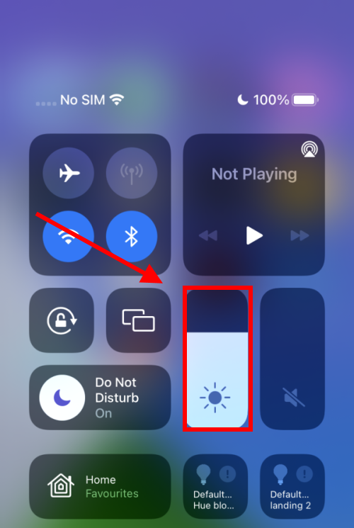 Open Control Centre and tap and hold on the Screen Brightness slider